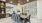 large dining table with blue velvet chairs in the Bainbridge Bayview apartment community clubhouse