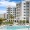 a resort-style pool with a building behind it